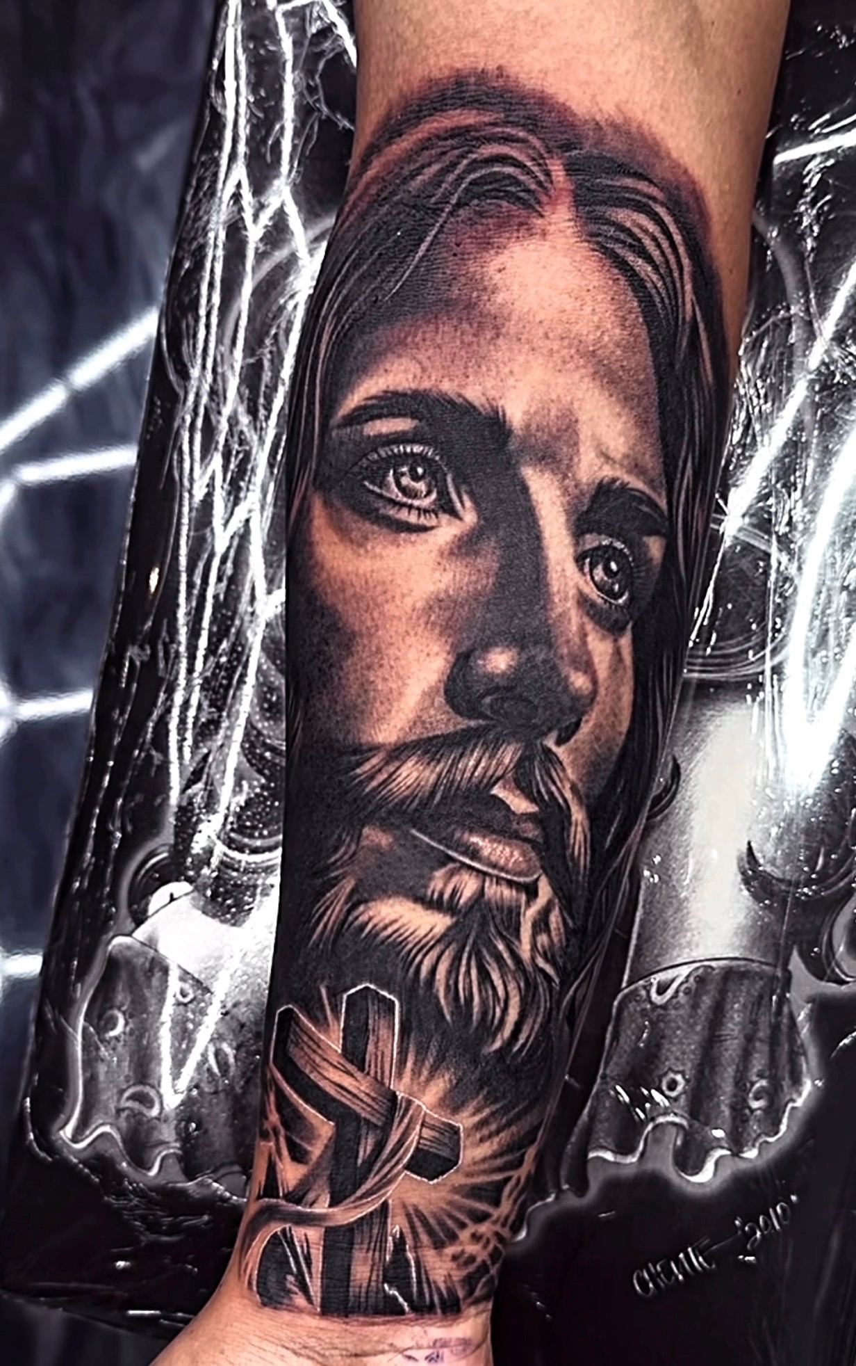 Black and gray realistic tattoo close-up